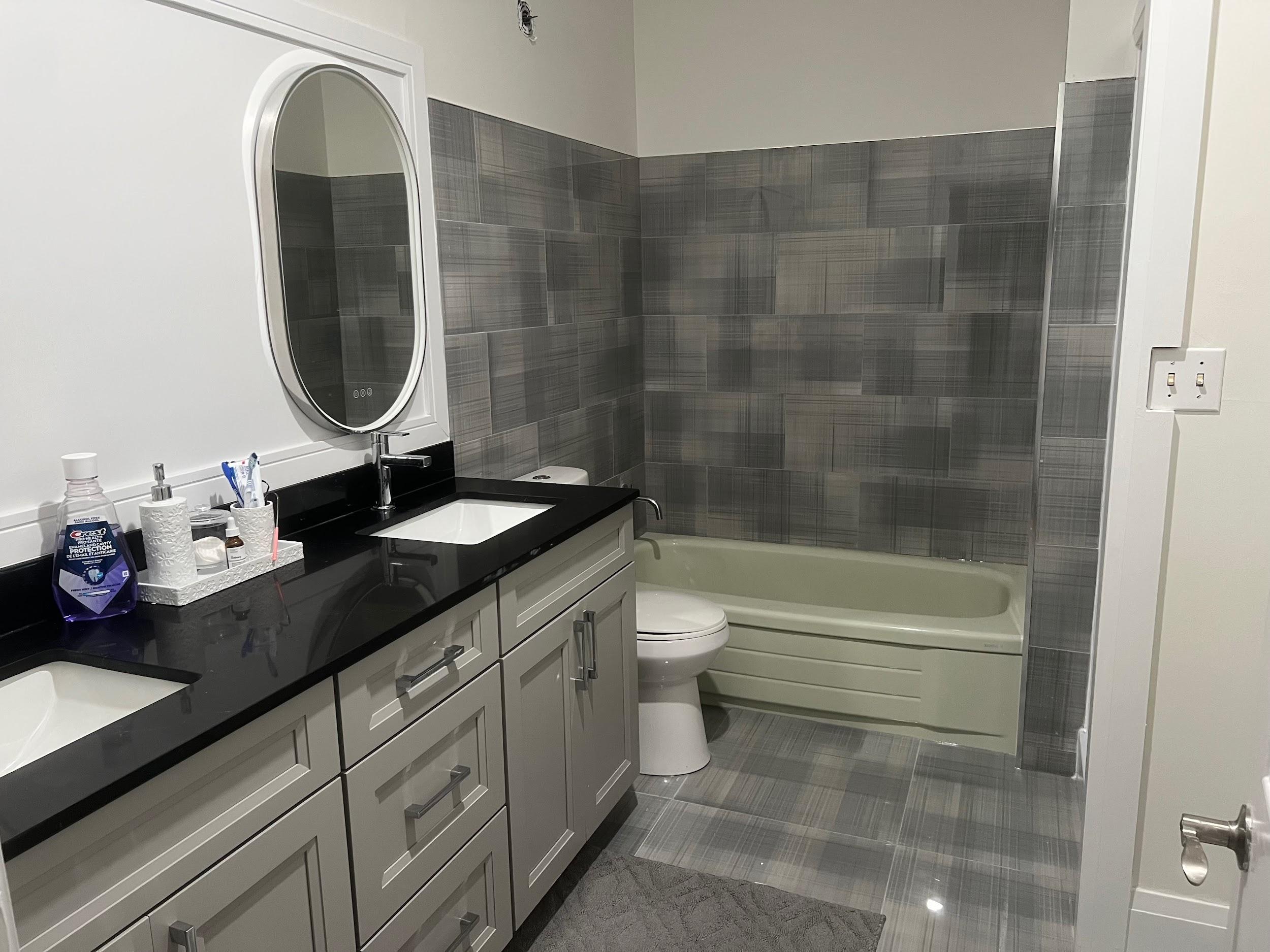 Bathroom vanity and tub remodel with tile surround
