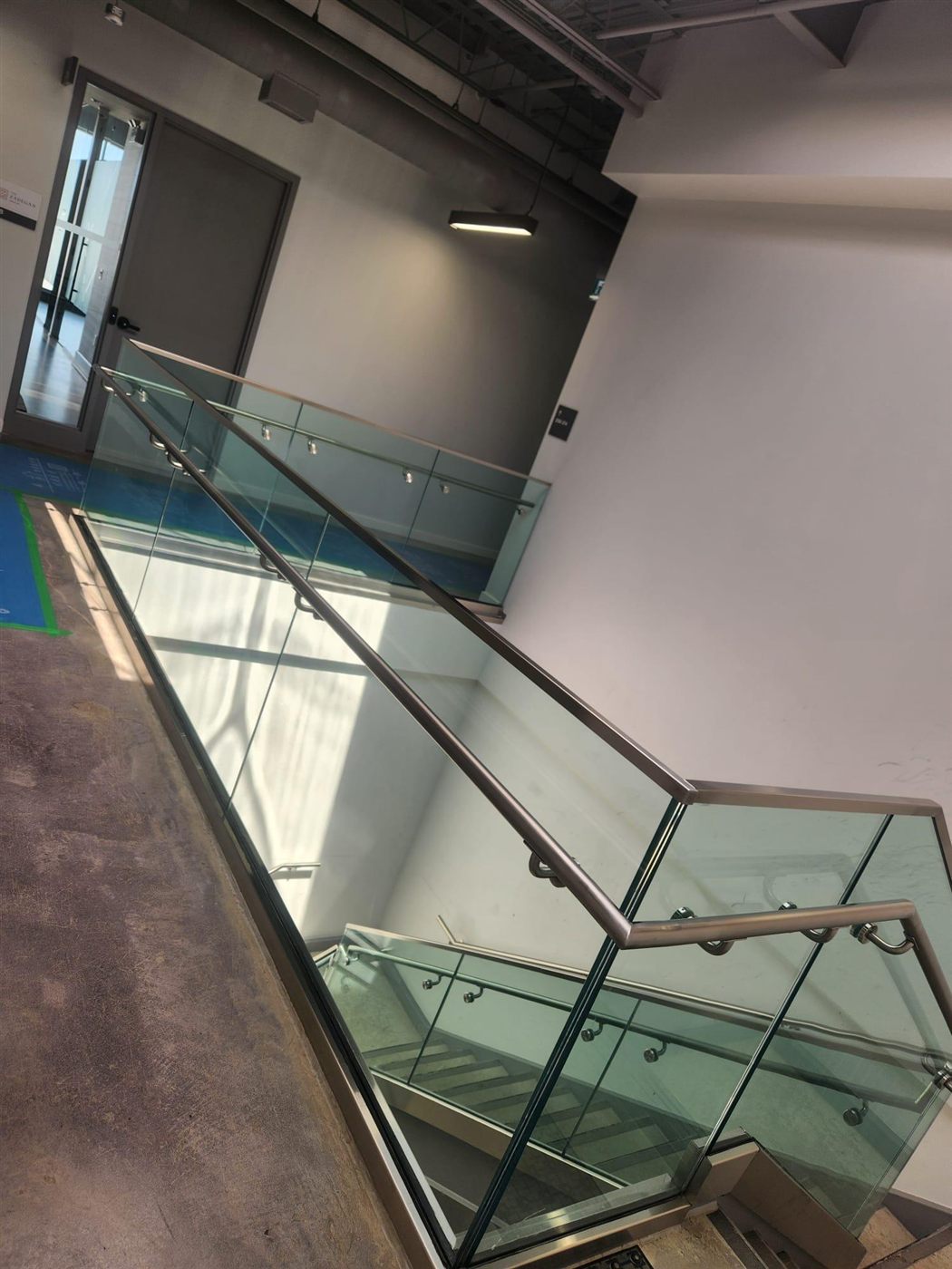Modern commercial glass staircase railing