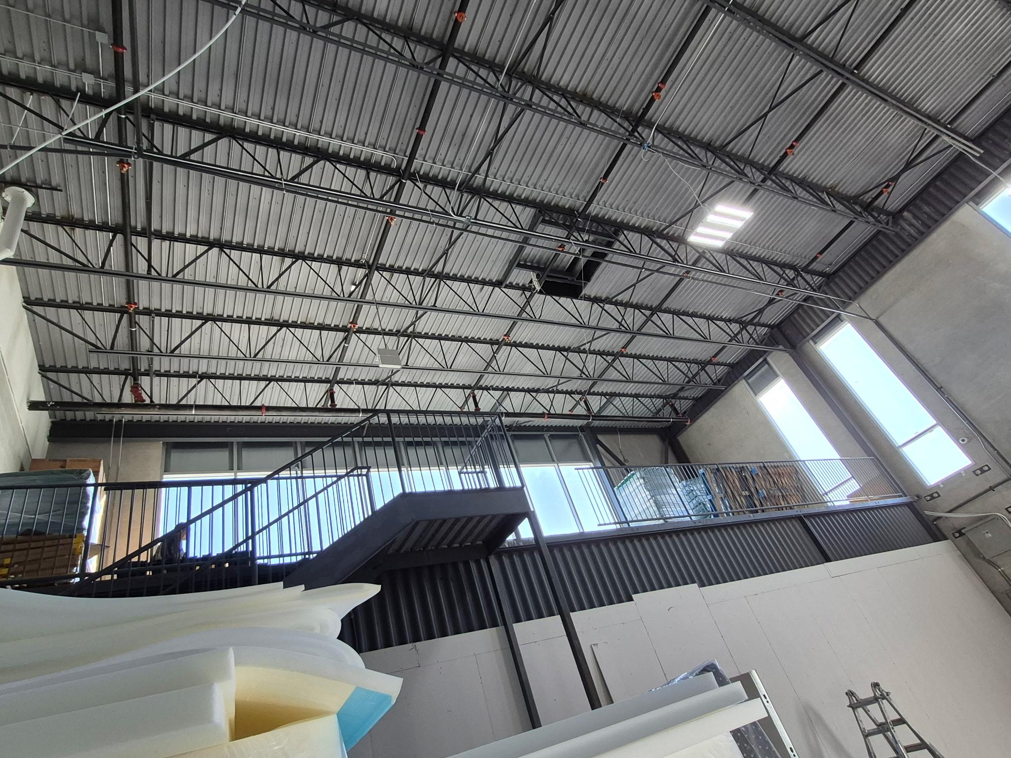 Warehouse mezzanine staircase and guardrail