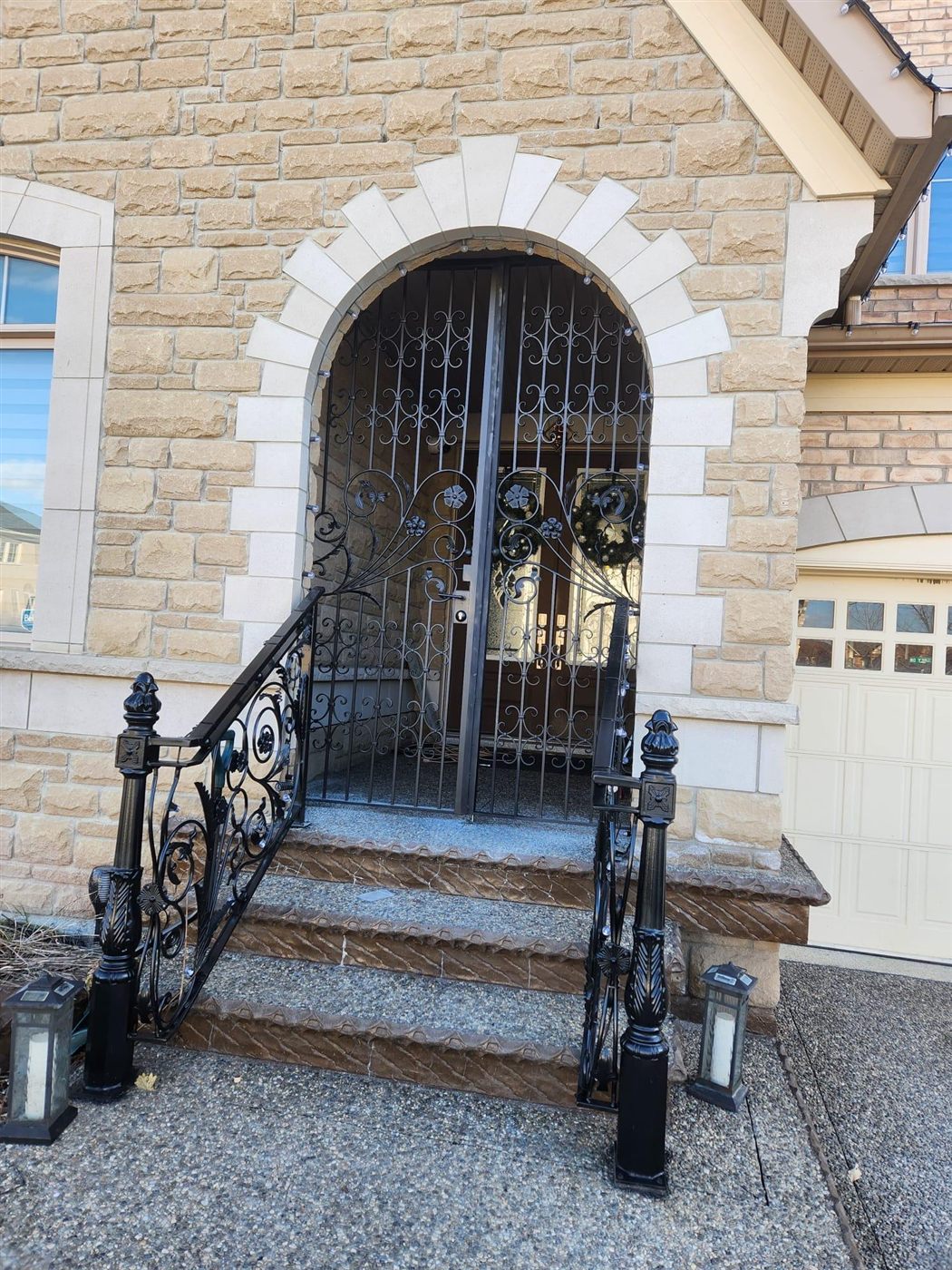 Wrought iron entry gate and matching fence